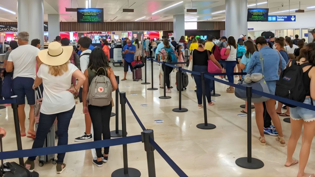 Immigration area at Cancun Airport during peak season.